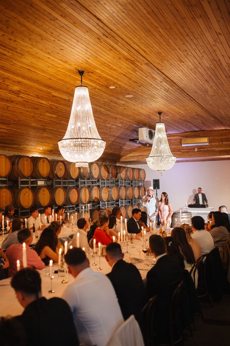 Gigi&rsquo;s at night, guests seated under the lit chandeliers